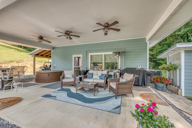 view of patio with grilling area, an outdoor living space, and ceiling fan