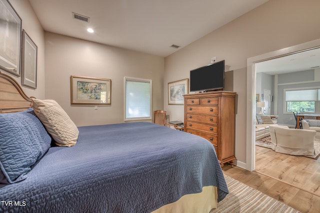 bedroom with light hardwood / wood-style floors