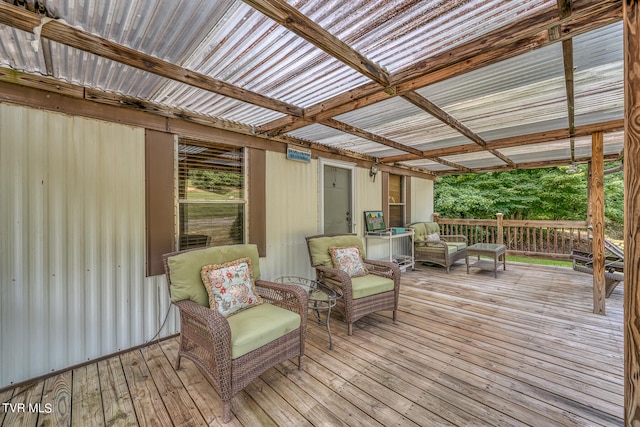 wooden terrace with an outdoor hangout area