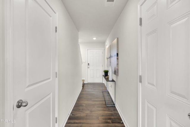 hall with dark wood-type flooring