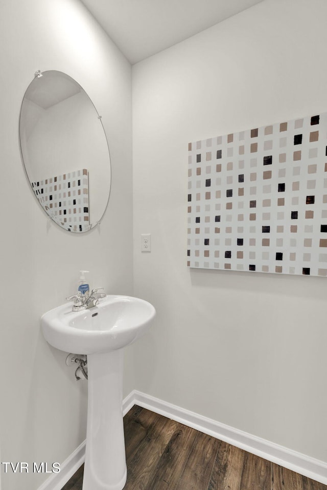 bathroom with hardwood / wood-style flooring