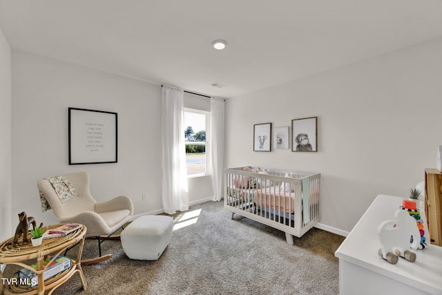 carpeted bedroom with a crib