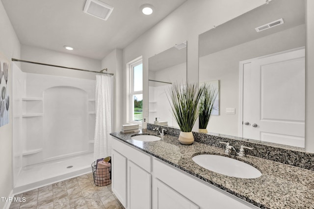 bathroom with vanity and a shower with curtain