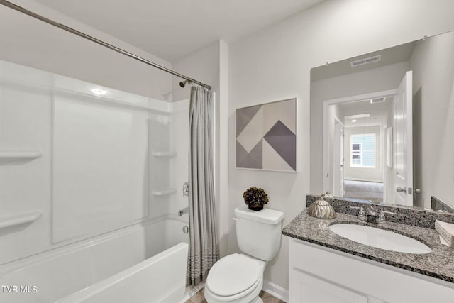 full bathroom featuring shower / tub combo with curtain, toilet, and vanity