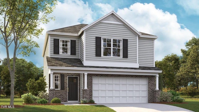 view of front of property featuring a front yard and a garage