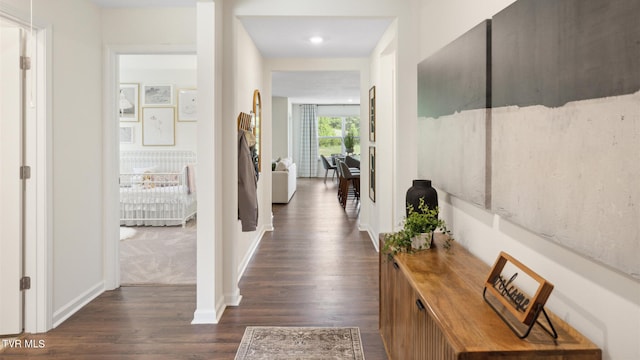 hallway featuring dark hardwood / wood-style floors