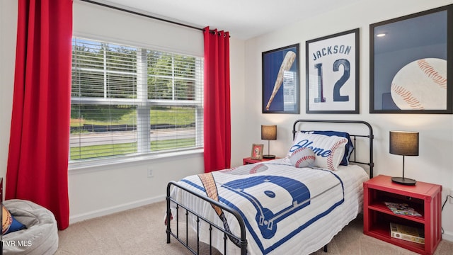 bedroom featuring light carpet