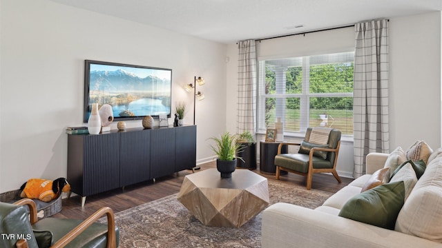 living room with dark hardwood / wood-style flooring