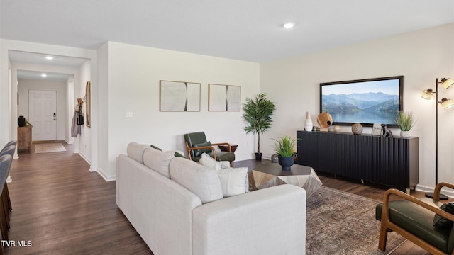 living room with dark hardwood / wood-style flooring