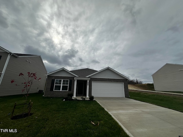 view of front of home with a front lawn and a garage