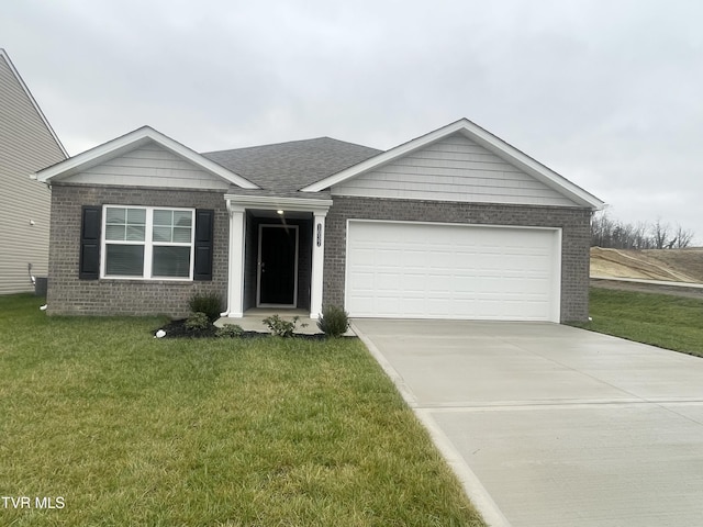 ranch-style home featuring a garage and a front lawn