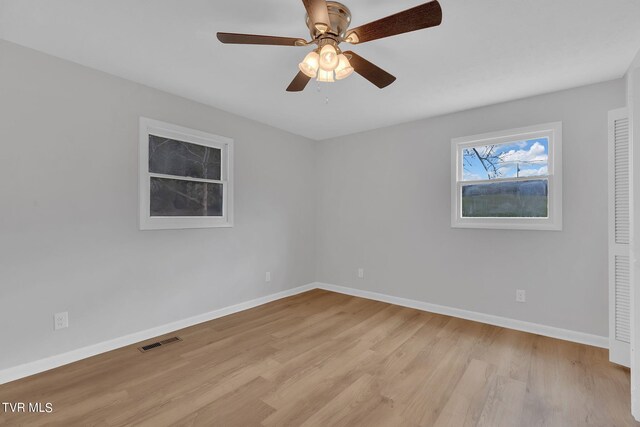 unfurnished room with light hardwood / wood-style flooring and ceiling fan