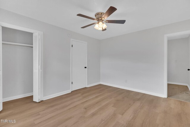 unfurnished bedroom with light wood-type flooring and ceiling fan