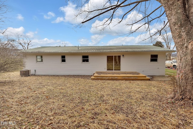 rear view of property featuring cooling unit