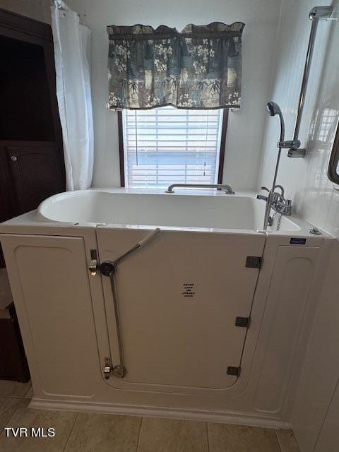 bathroom with tile patterned flooring