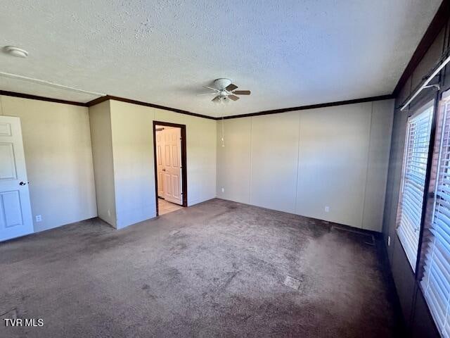 unfurnished bedroom with a textured ceiling, carpet floors, ceiling fan, and crown molding