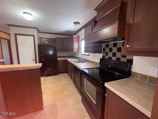 kitchen featuring backsplash, black appliances, sink, ornamental molding, and custom range hood