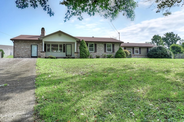 ranch-style home with a front yard