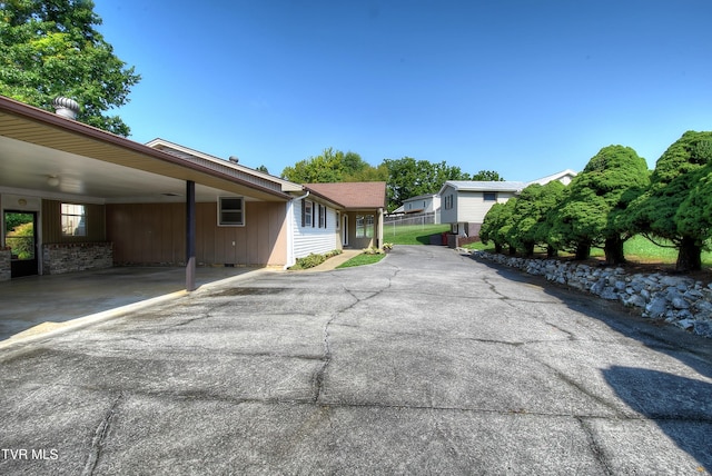 exterior space with a carport