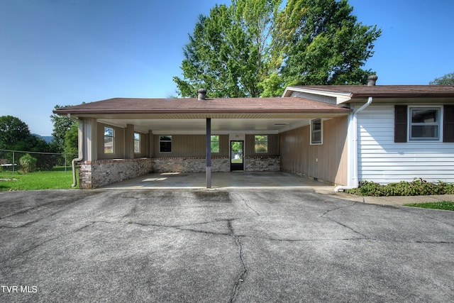 view of vehicle parking featuring a carport