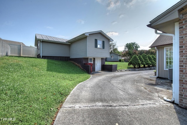 view of property exterior featuring a yard