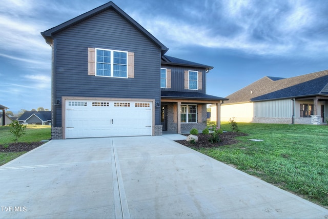 view of front of home with a garage and a front lawn