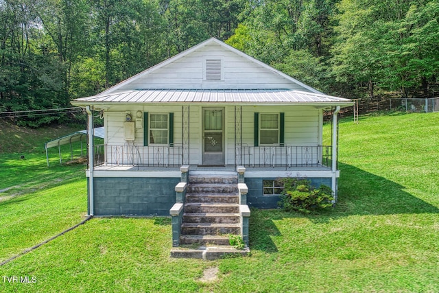 bungalow-style home featuring a porch and a front yard