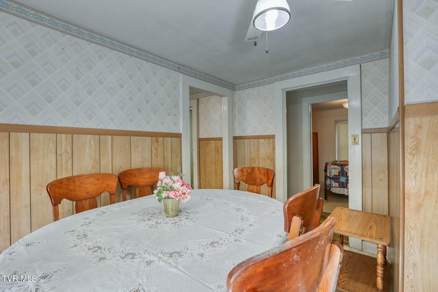 dining area featuring crown molding