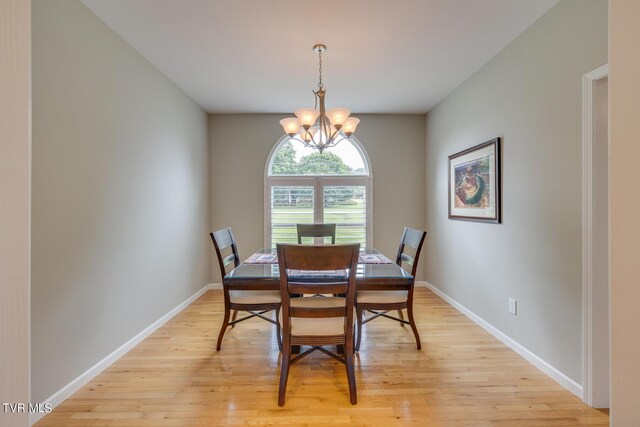 dining room featuring light hardwood / wood-style floors and an inviting chandelier