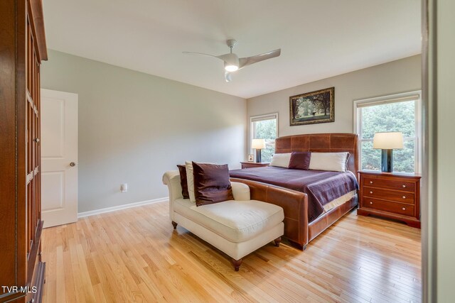 bedroom with ceiling fan and light hardwood / wood-style floors