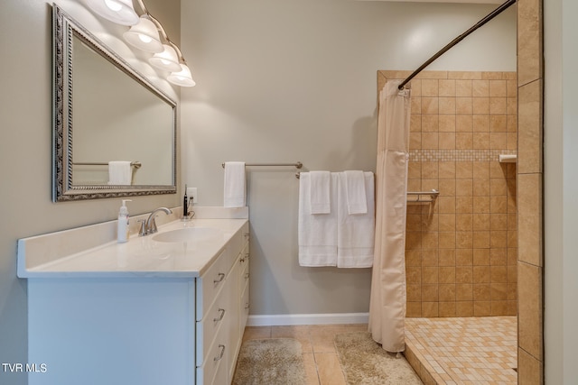 bathroom featuring curtained shower, vanity, and tile patterned floors