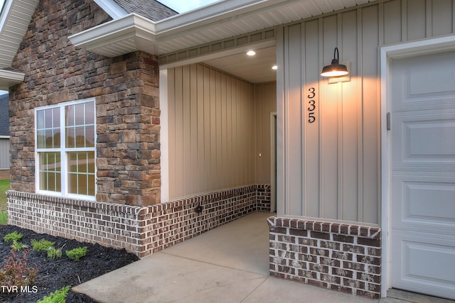 view of exterior entry with a garage