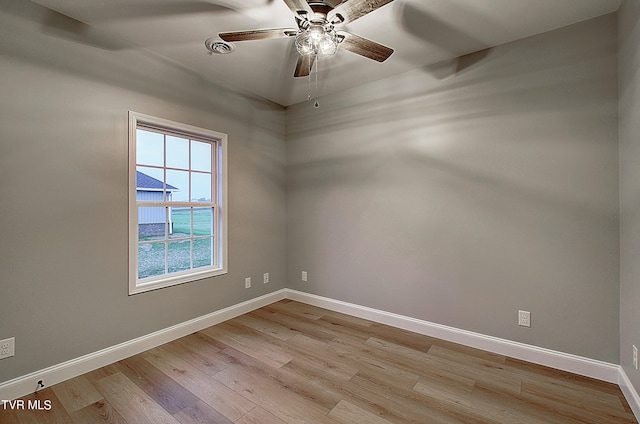 unfurnished room with ceiling fan and light wood-type flooring