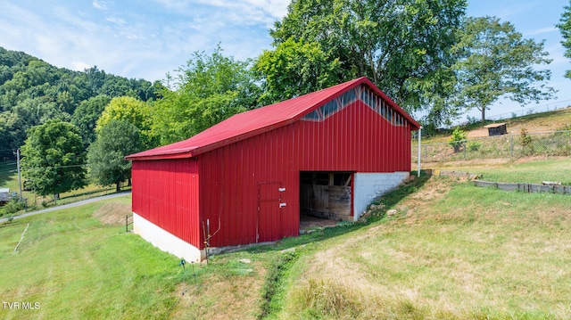 view of outdoor structure with a yard