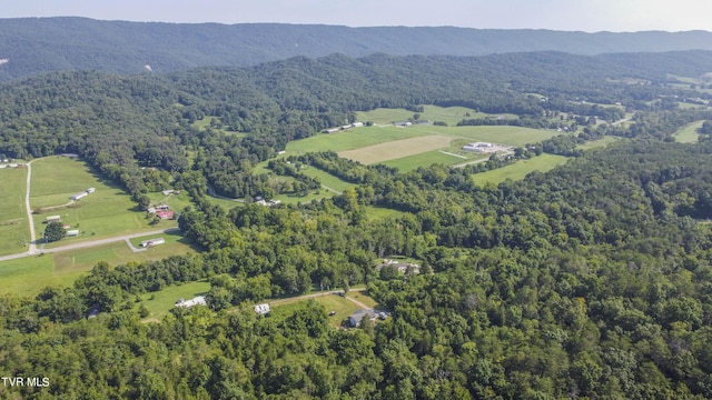 bird's eye view featuring a wooded view