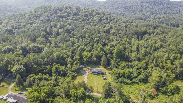 bird's eye view featuring a forest view