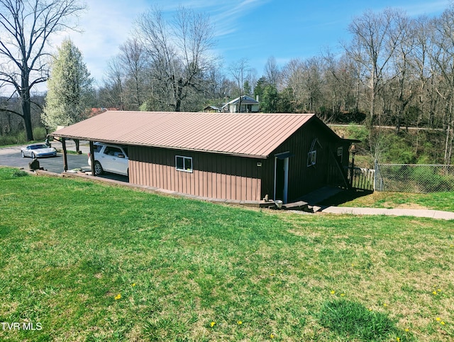 view of side of home featuring a yard