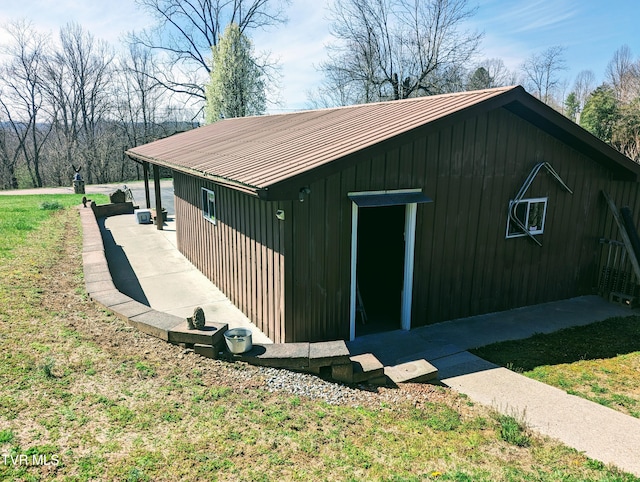 view of side of home featuring a lawn