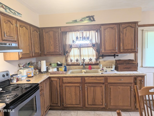 kitchen with light tile patterned flooring, sink, and stainless steel electric range oven