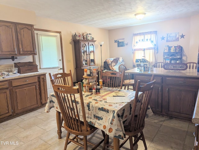 dining room featuring light tile patterned floors