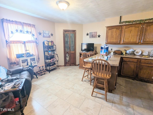 dining area featuring light tile patterned floors