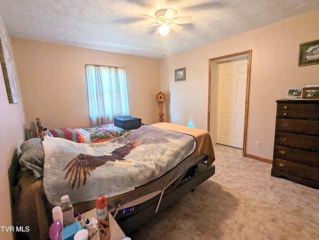 bedroom with light carpet and ceiling fan