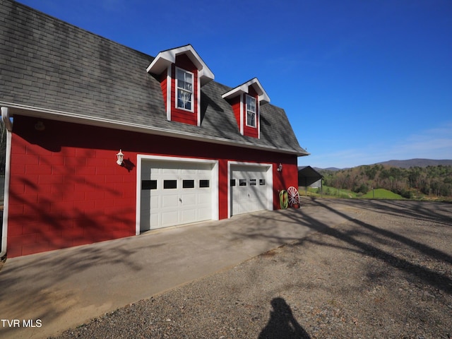 garage featuring a garage and a mountain view