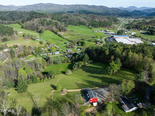 drone / aerial view featuring a rural view and a mountain view