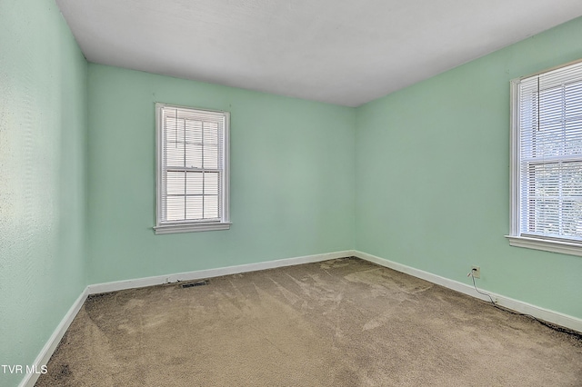 empty room featuring carpet floors