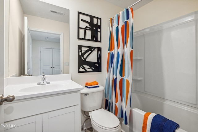 full bathroom featuring vanity, toilet, and shower / tub combo with curtain