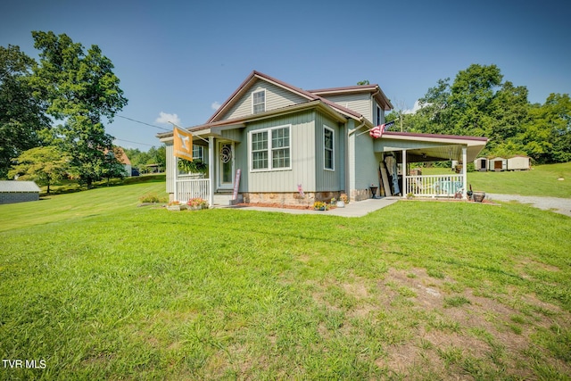 view of front of home featuring a porch, board and batten siding, and a front yard