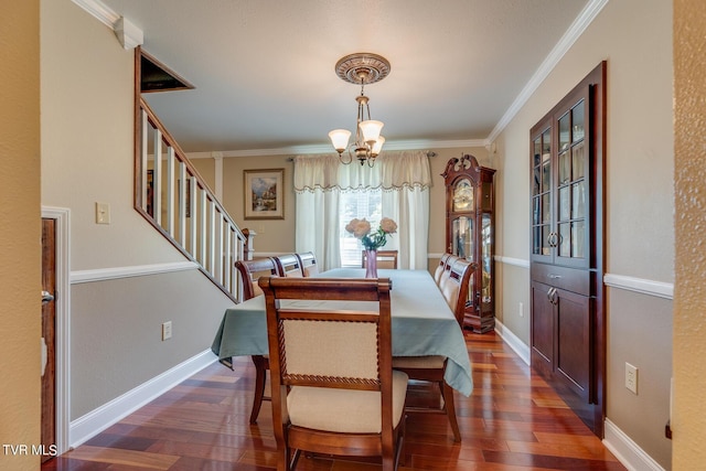 dining room with baseboards, dark wood finished floors, an inviting chandelier, stairs, and crown molding