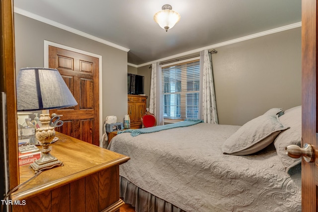 bedroom featuring crown molding