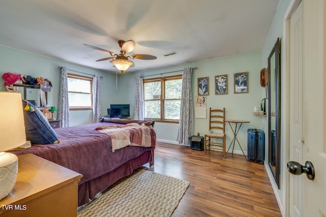 bedroom featuring hardwood / wood-style flooring and ceiling fan